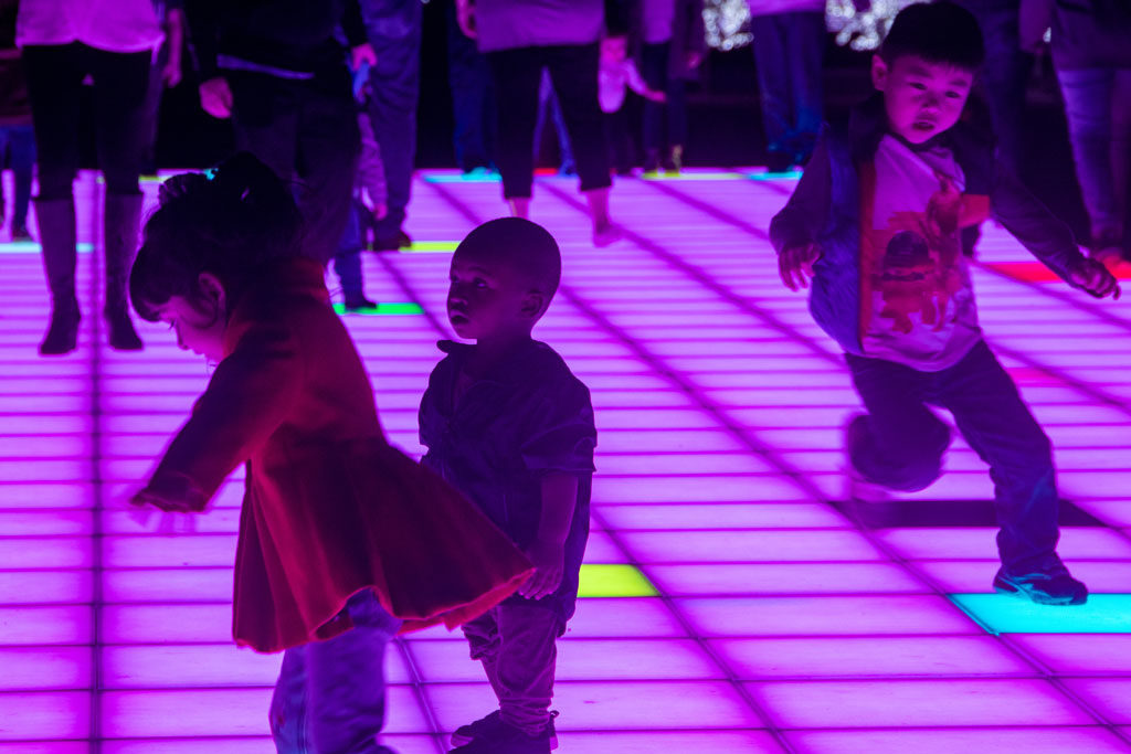 Children enjoying the light floor at Magic Winter Lights, La Marque, TX