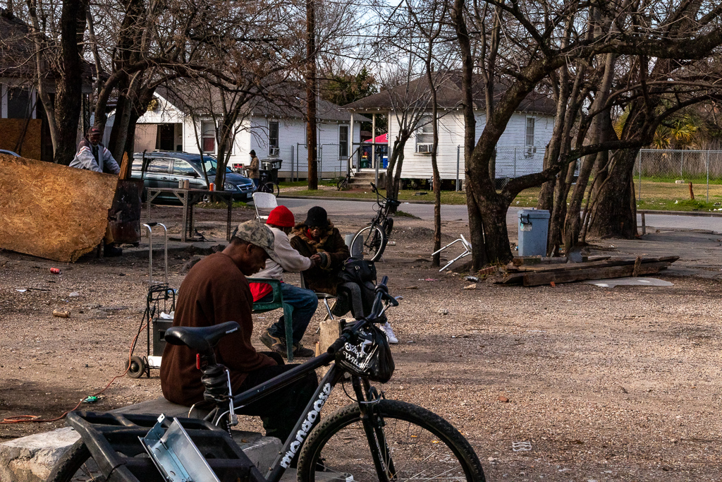 Residents enjoying the afternoon in a corner lot of the Fifth Ward section of Houston, TX.